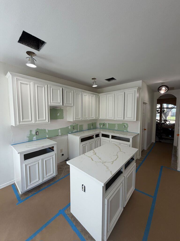 Gold-veined quartz island and counters during installation